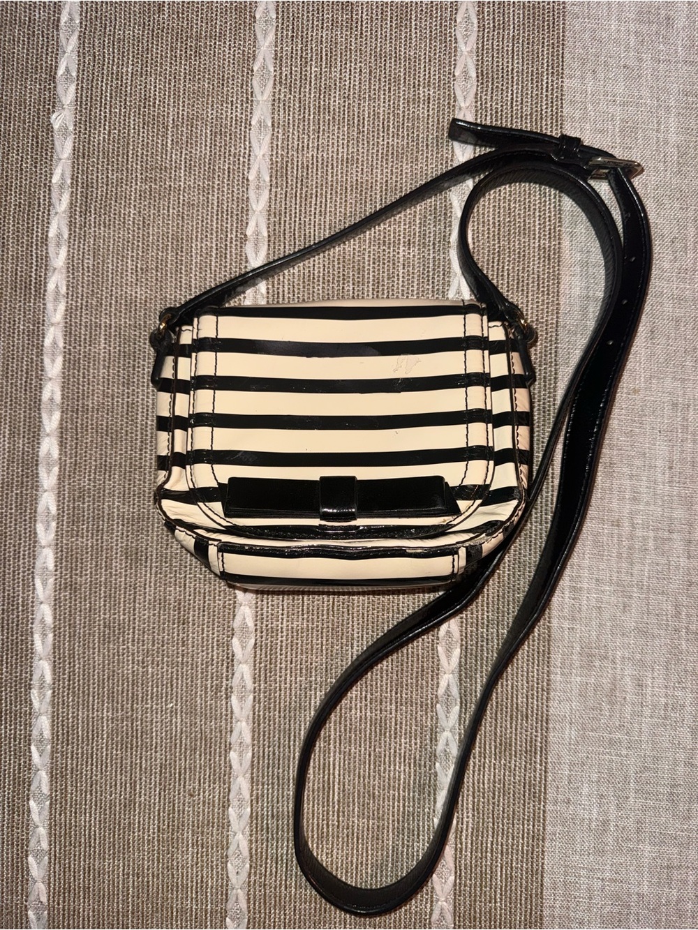 kate spade Black and Cream Striped Crossbody with Bow Accent